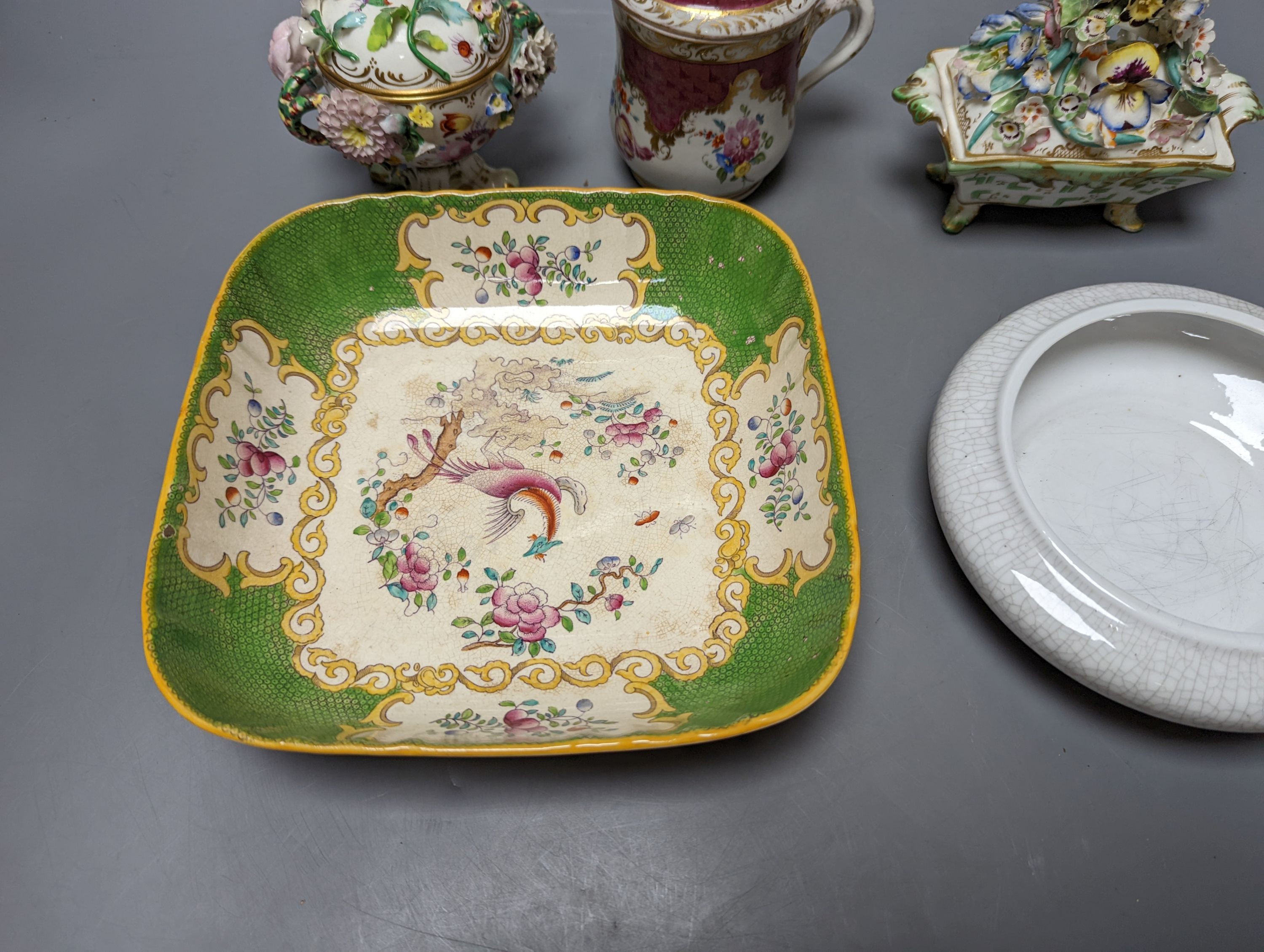 A Meissen style chocolate cup and cover, two mid 19th century English porcelain flower encrusted pots and covers and two dishes